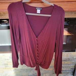 Venus burgandy shirt. Buttons and tie at bottom.  Size M.